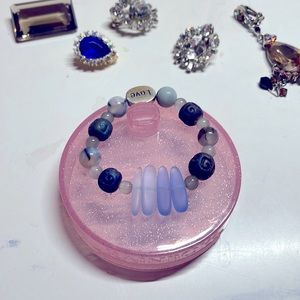 Pure blue faux sea glass on strong elastic band with pretty blue beads.